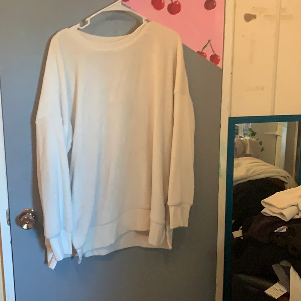 a white, fuzzy warm sweater that is good for fall